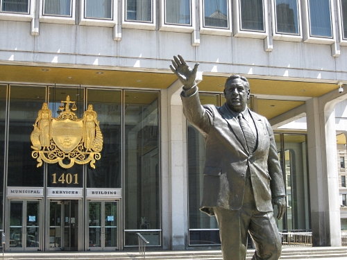 The front of the Municipal Services Building across from City Hall, where much of city IT leadership is based, featuring the statue of former Mayor Frank Rizzo.