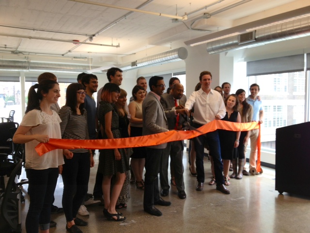 The Curalate team poses with Mayor Michael Nutter for a ribbon cutting at its new office in July 2013.