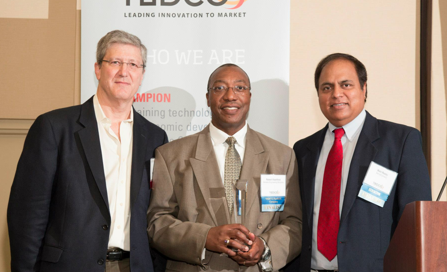 TEDCO CEO Rob Rosenbaum, left, presenting ICE awards in May 2013.
