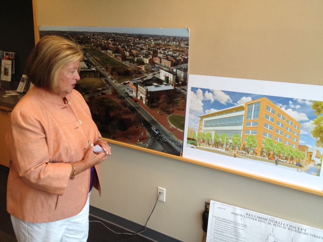 University of Maryland BioPark executive director Jane Shaab looks at a photo from 2003 of what has become a 12-acre research campus and plans for the future during an interview in August 2013.