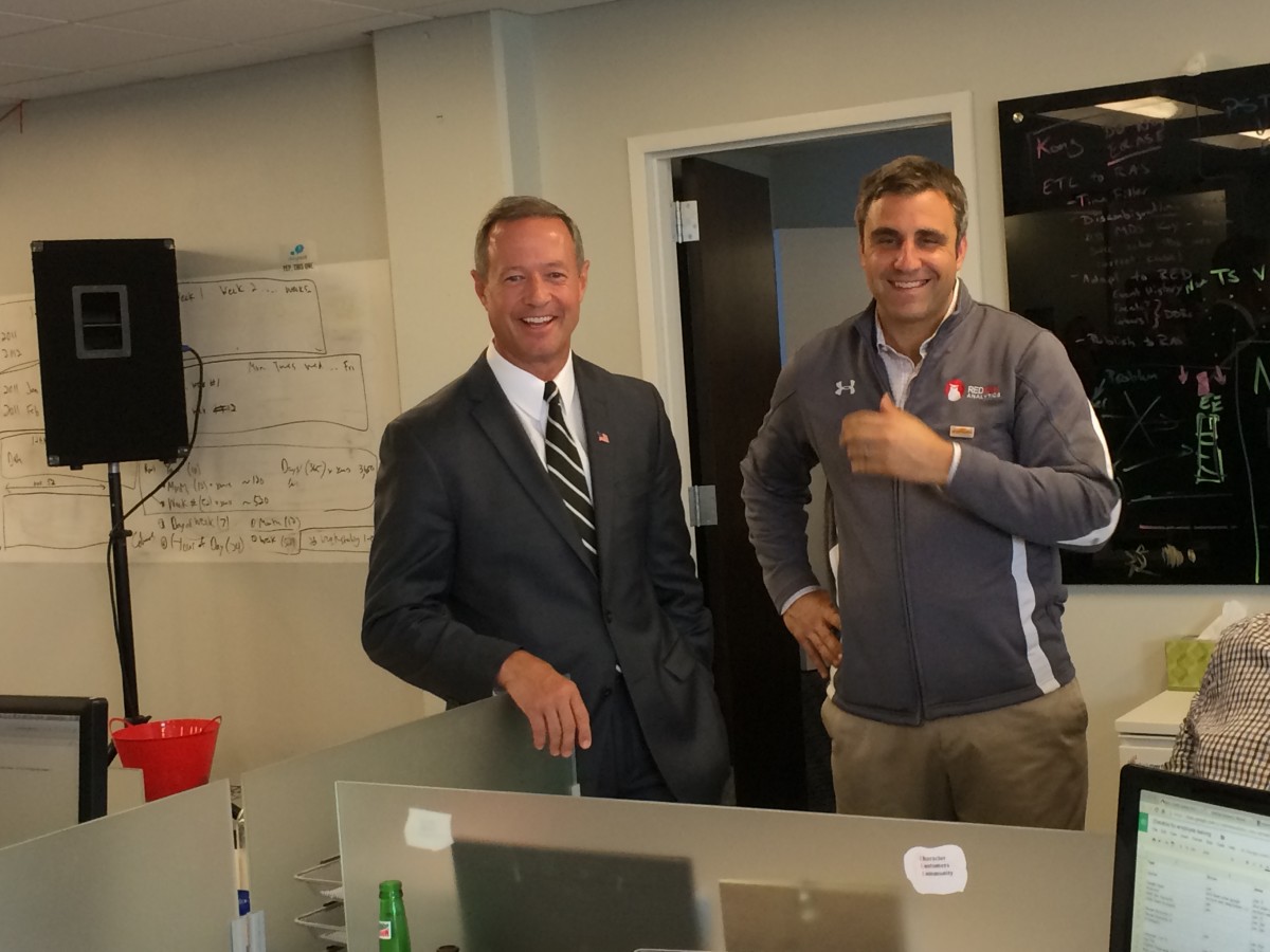 Then-Gov. Martin O’Malley, left, tours RedOwl Analytics’ Baltimore offices, with cofounder Guy Filippelli.
