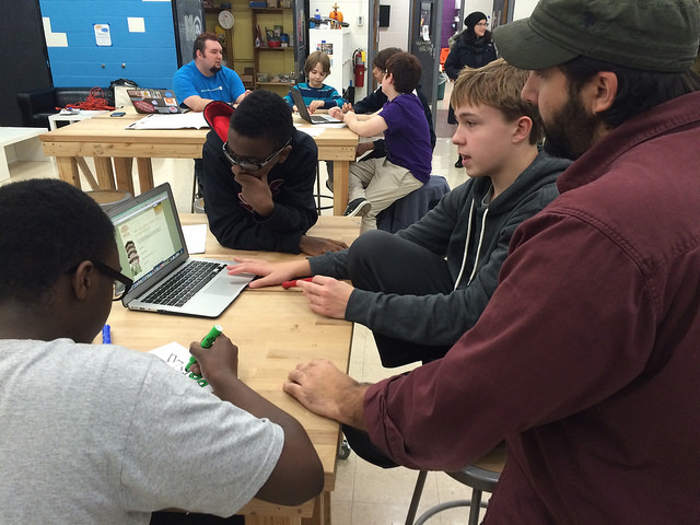 Students hard at work during last week’s WebSlam, assisted by staffer Jonathan Prozzi. (Photo by Tyler Waldman)