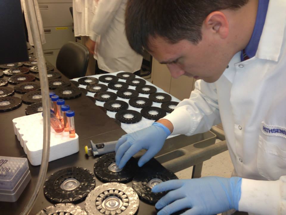 A PathSensors technician works during a 2013 visit from Gov. Martin O’Malley.