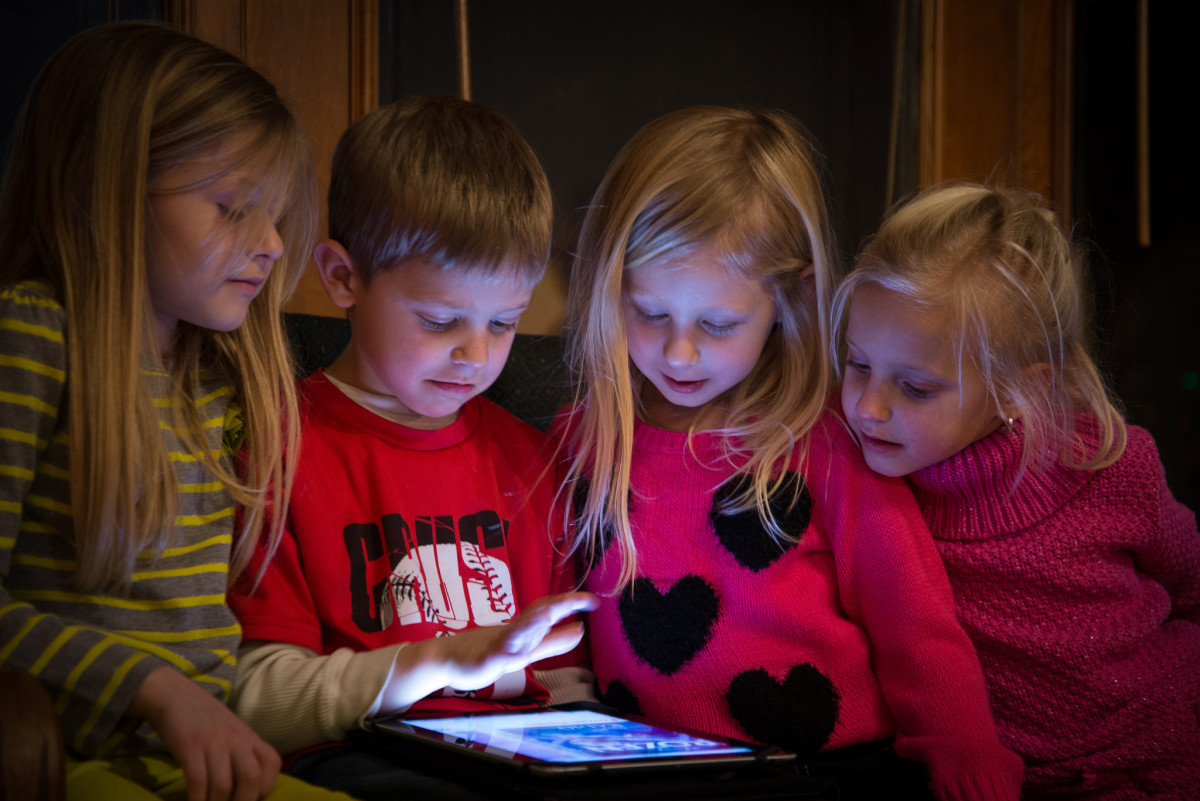 Children using a tablet. 