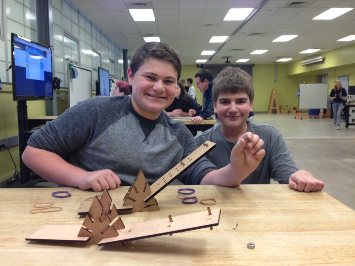 Darren Brumberg (left) and Nick Suiter are building a particle accelerator.