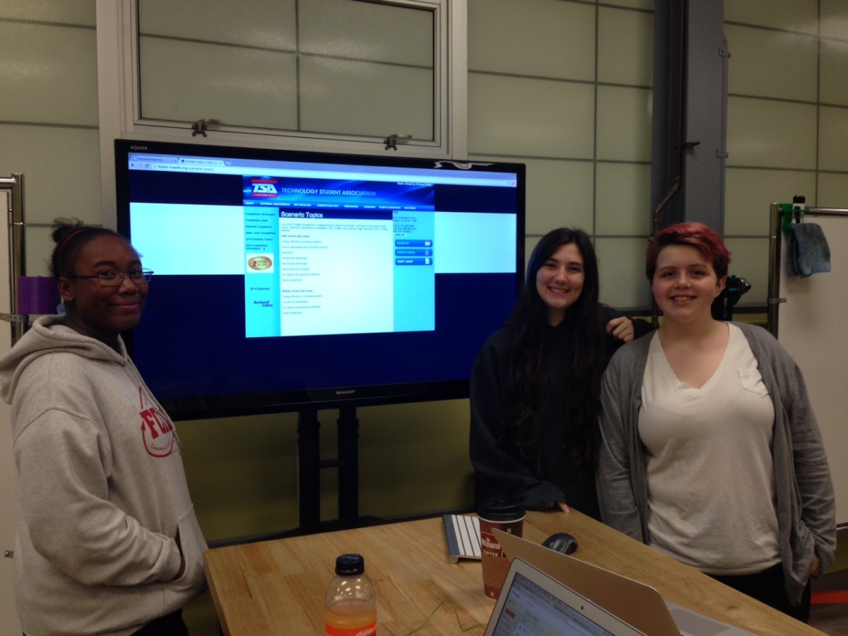 Left to right: Jakayla Allen, Sierra Milhoan and Olivia Smith-Donovan study for an upcoming STEM competition.