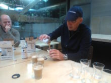 La Colombe cofounder Todd Carmichael pours a canned draft latte.