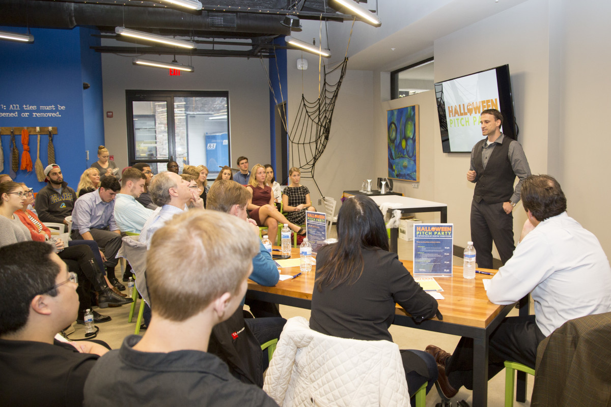 Students gather for a Halloween pitch party at the Horn building.