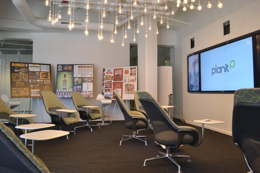 Planit's new media room is meant to feel like a movie theater instead of a conference room.