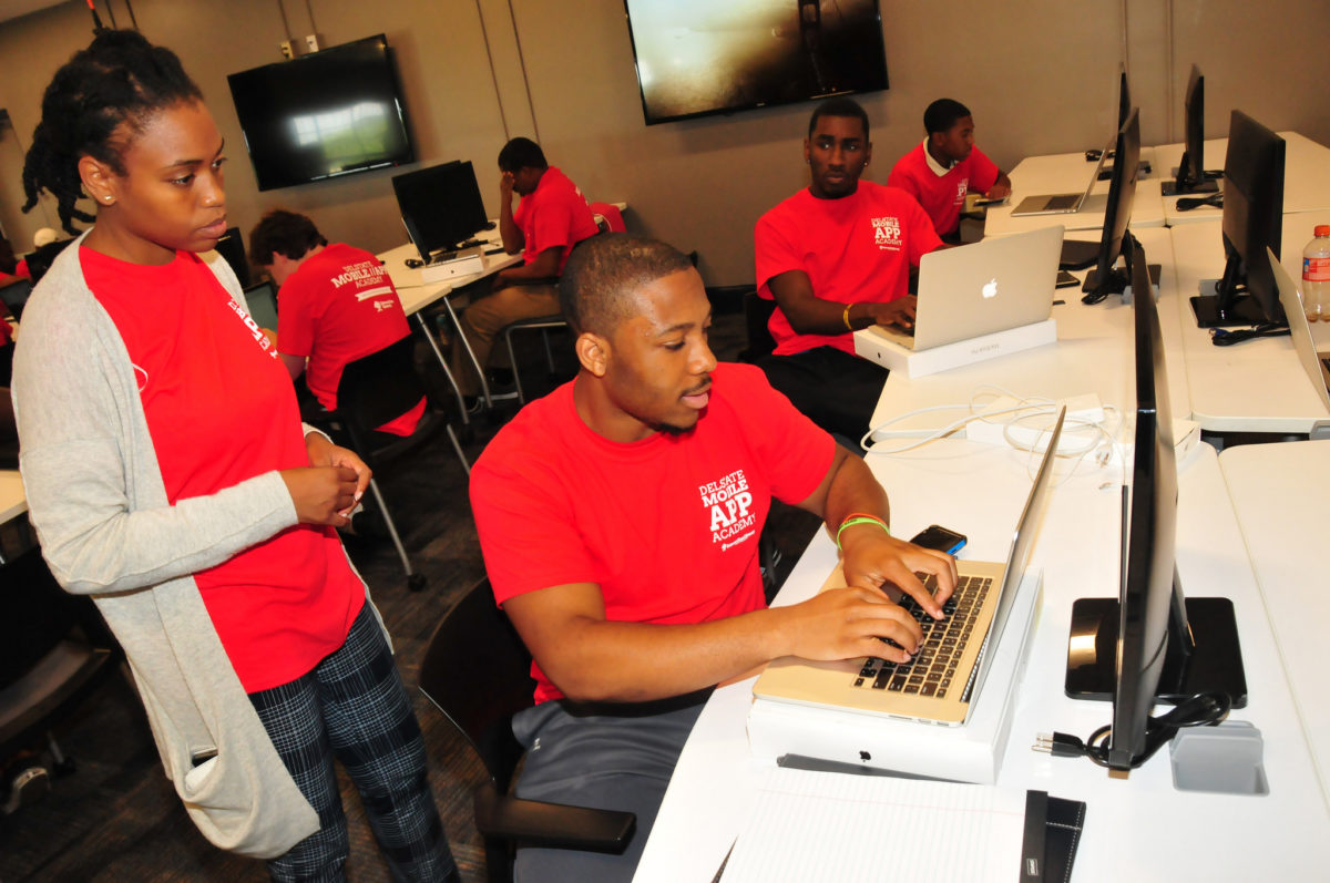 A Mobile App Academy instructor works with students. (Courtesy photo)
