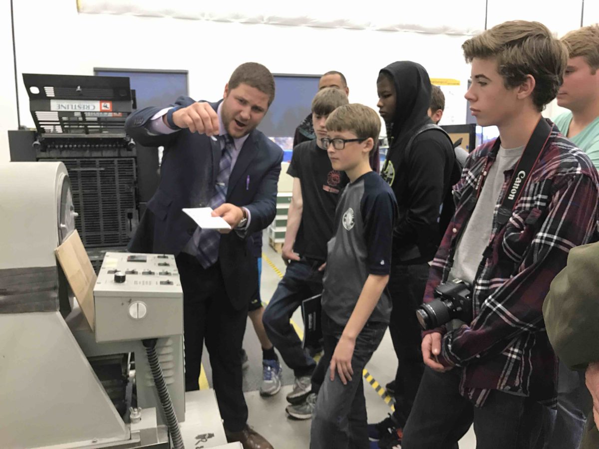 Ben Cook shows students around Strategic Factory.