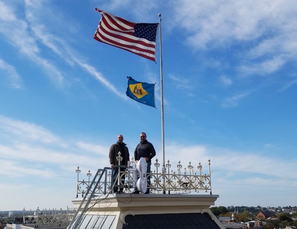 WhyFly cofounders Mike Palita (at left) and Mark Thompson on the roof of the Grand Opera House in Wilmington, Del.