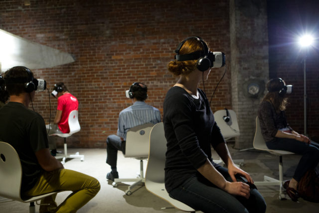 Participants watching virtual reality documentaries at the Camden International Film Festival.