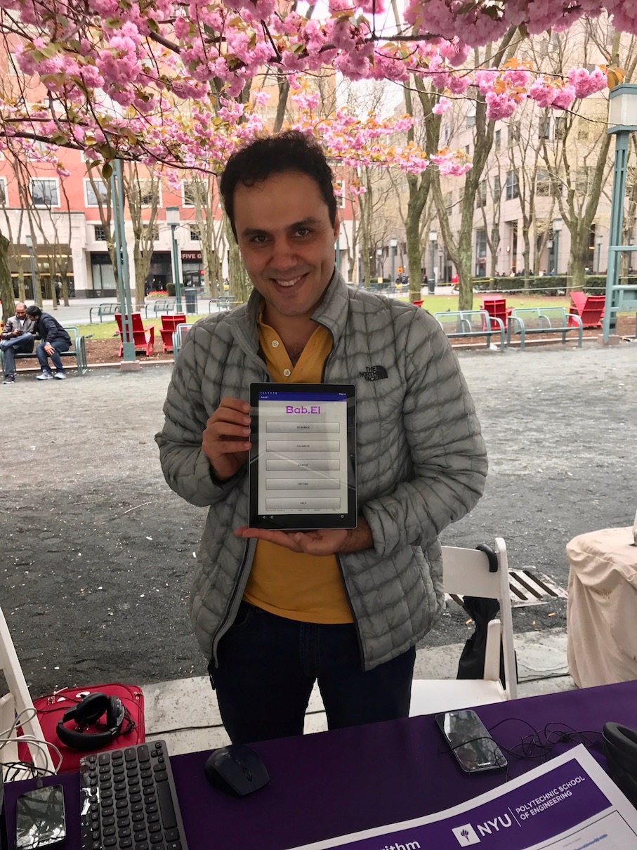 Roozbeh Soleymani holds up a display of his app, Bab.El, which filters background noise in phone calls.