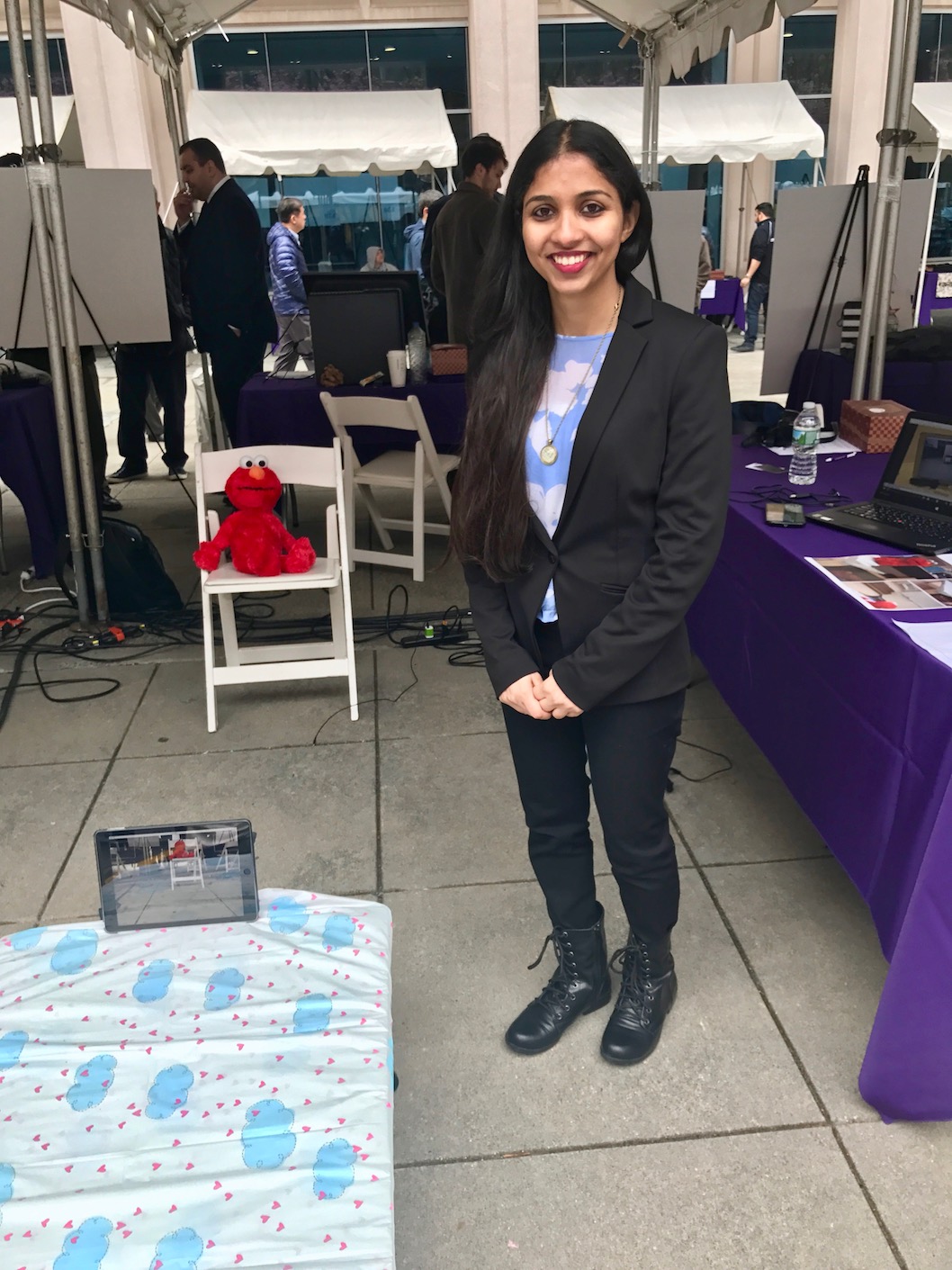 Tanaya Bhave, a master's student in mechatronics and robotics, with her invention, the Tot-Bot, below.