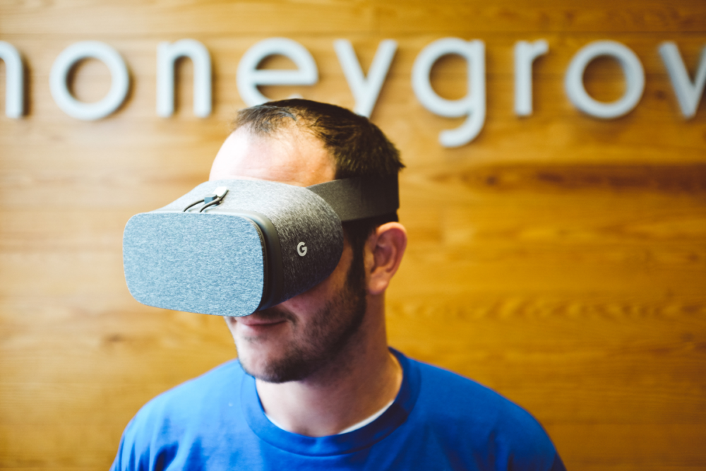 A honeygrow staffer wearing a virtual reality headset.