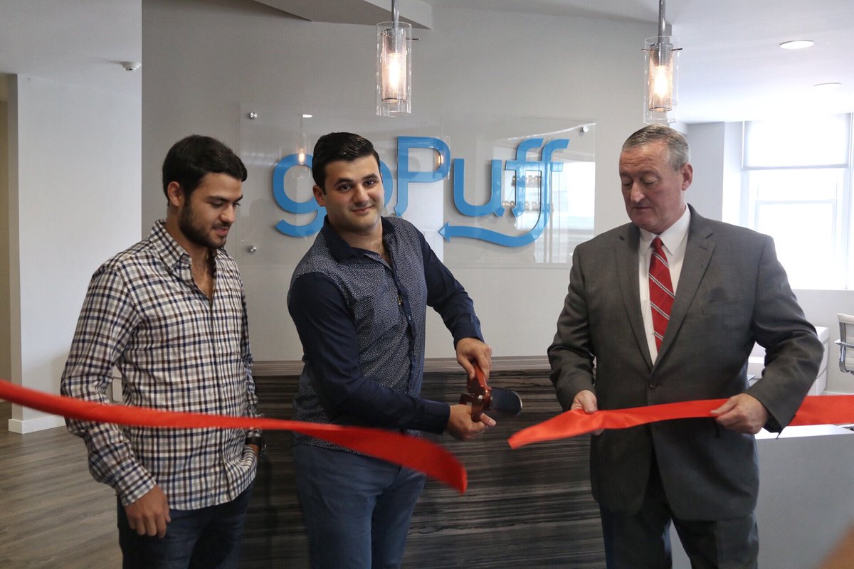 goPuff founders Yakir Gola (left) and Rafael Ilishayev cut the ribbon on their renovated offices in 2017 with the help of Philadelphia Mayor Jim Kenney.