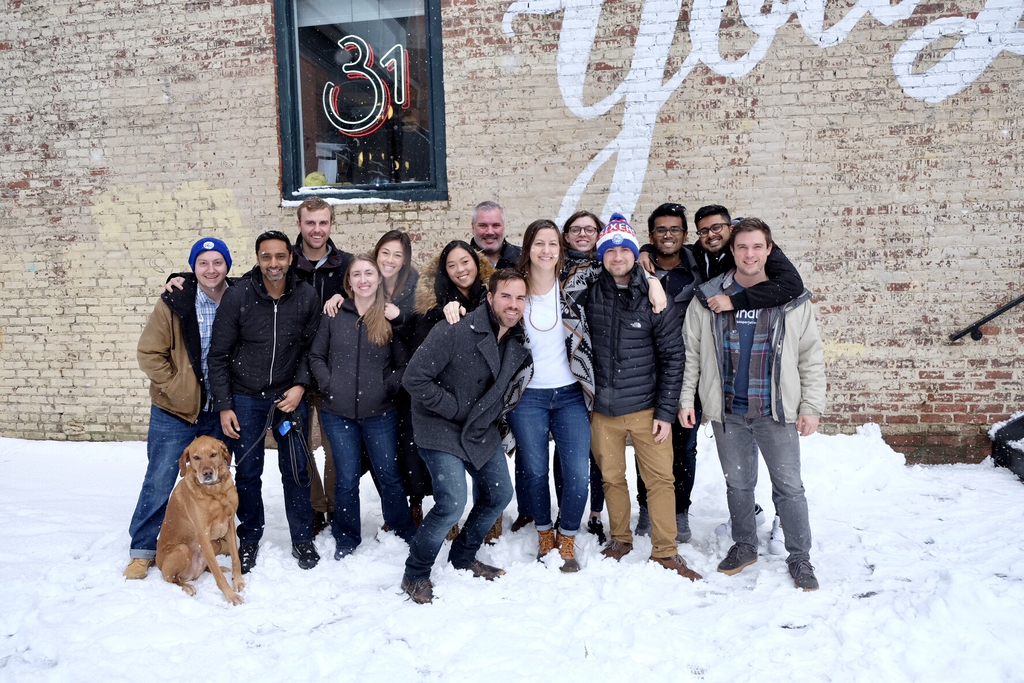 Some of RoundTrip’s team on a snowy day outside WeWork NoLibs.