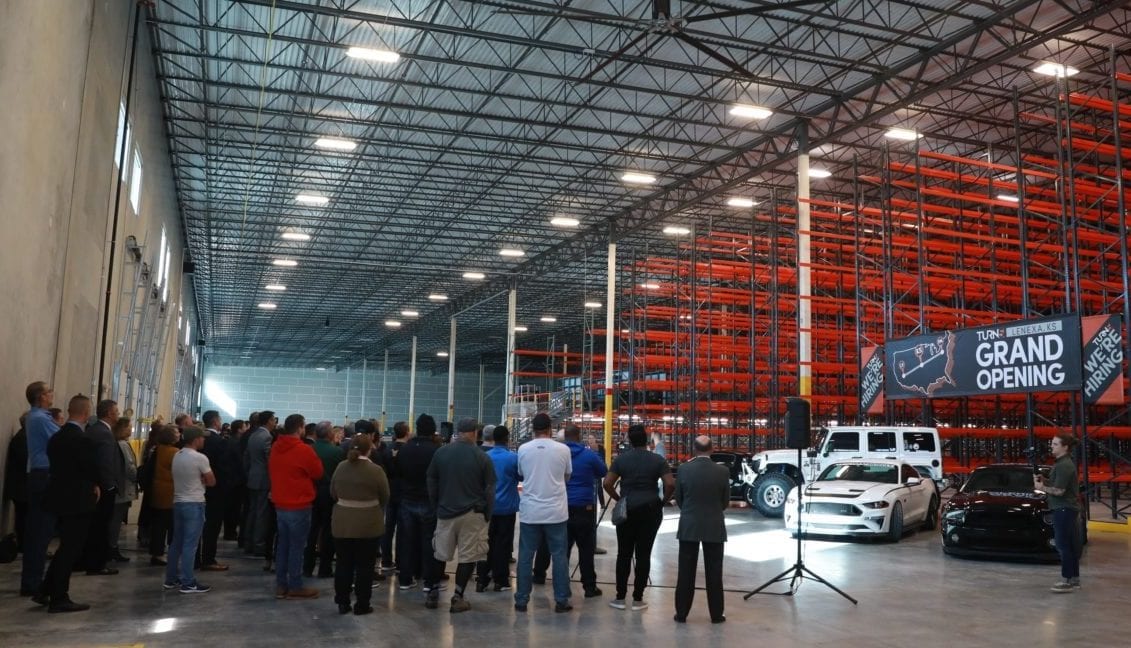 A crowd inside a warehouse.