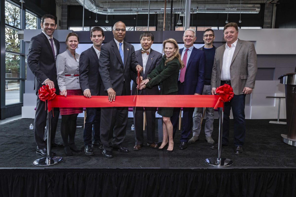 Leaders including UMD President Wallace Loh (center) and Lt. Gov. Boyd Rutherford of Maryland (fourth from left) cut the ribbon at the Capital One Tech Incubator in College Park. ((Photo courtesy of John Consoli/University of Maryland)