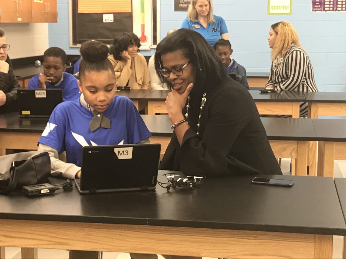 Taylor Howard (left), a Fort Worthington Elementary/Middle School 6th grade honors student, demos drone script with BCPS CEO Sonja Santelises. (Photo by Stephen Babcock)