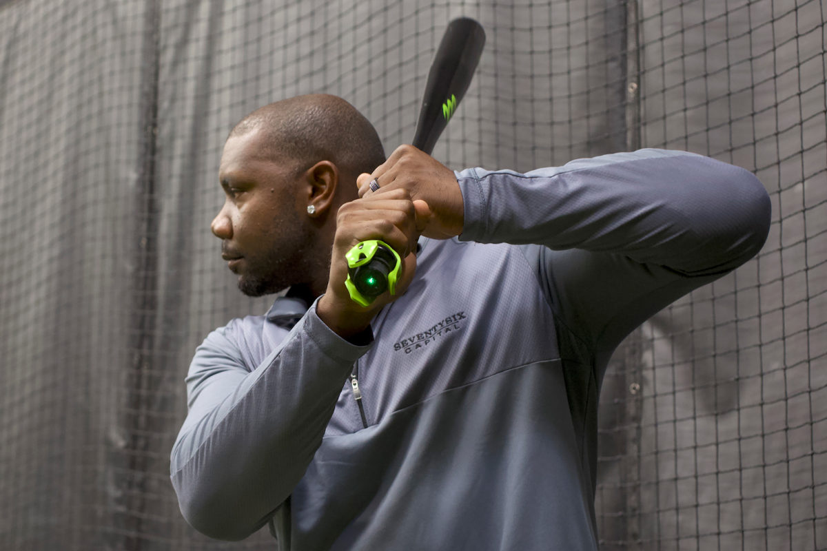 The green add-on to the knob of the bat — on display here by Howard  — helps track hitter’s swing.
