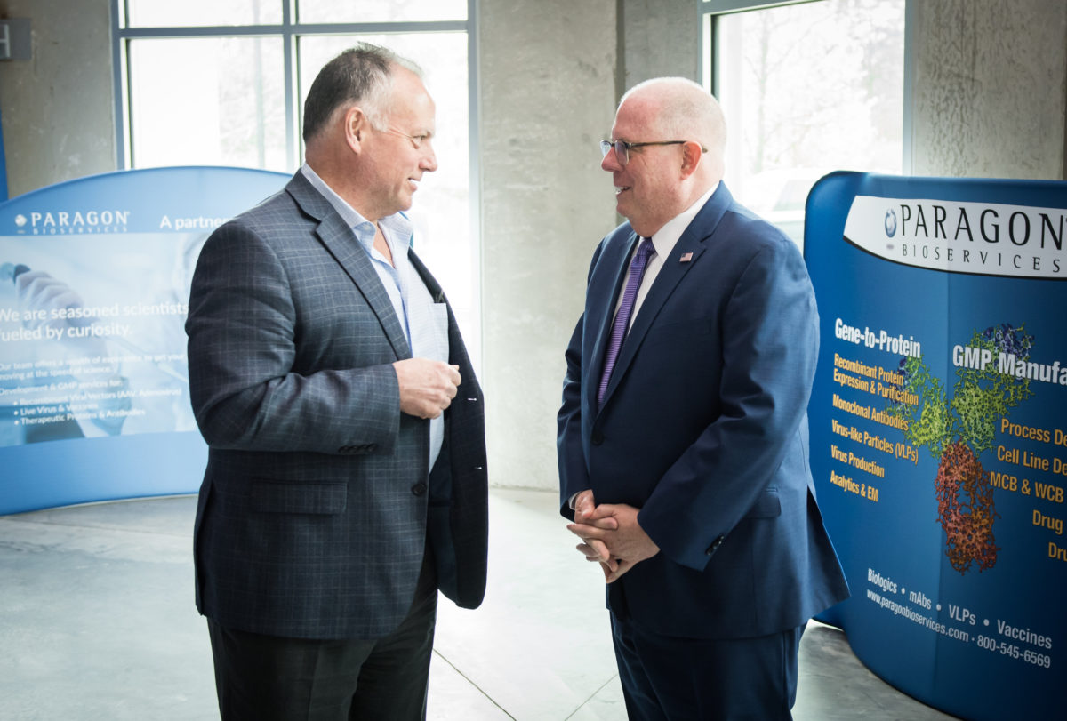 Governor Larry Hogan and Paragon Bioservices CEO Pete Buzy. (Courtesy photo by Kevin Allen)