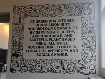 The Green Box mission statement, within a mural by Dan Fetters.