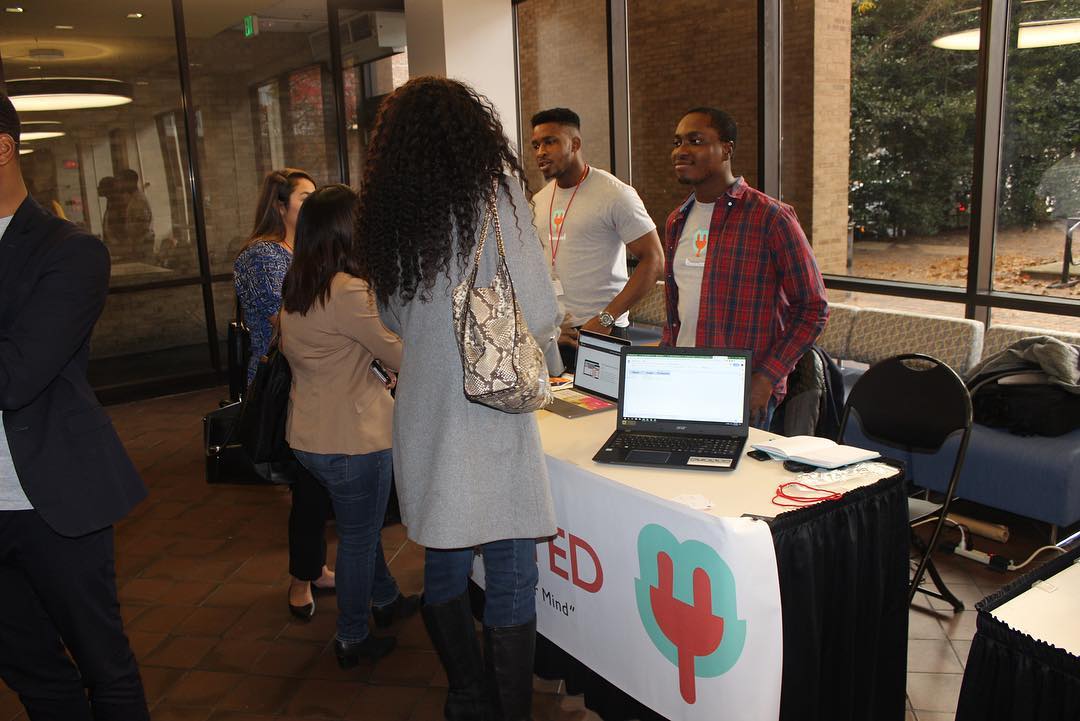Entrepreneurs discuss their business with attendees at the 2018 Minority Innovation Weekend.