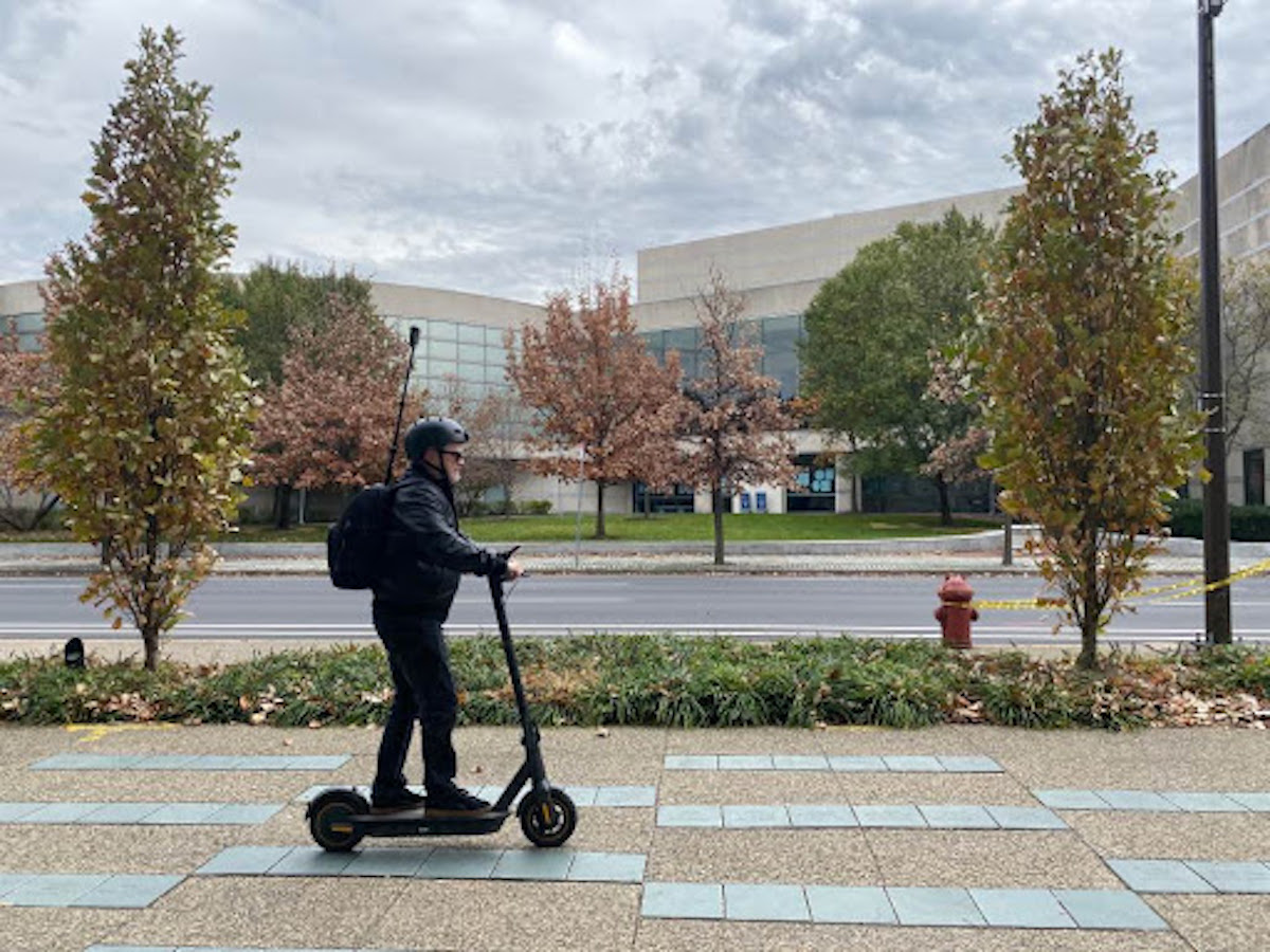 Mark Henninger on his electric scooter, which he rides to capture 360-degree images of the city. 