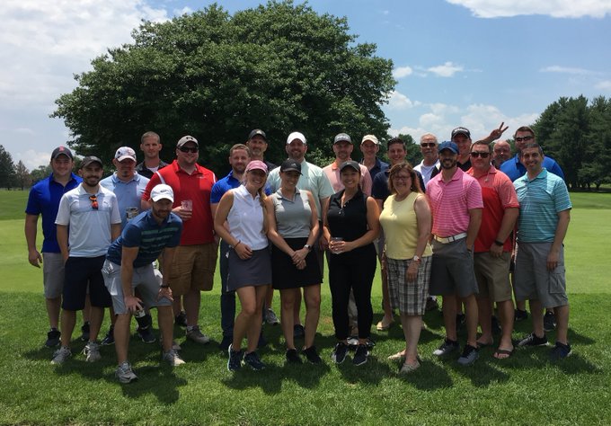 The CACI International team on a team outing in June 2019. 
