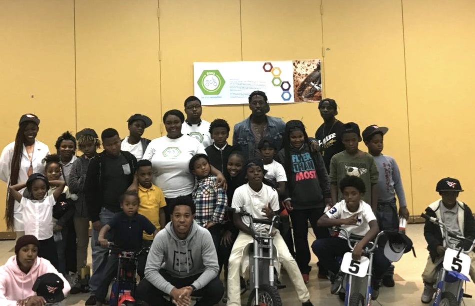 B-360 students with Chino Braxton (bottom row, 3rd from left), a  professional dirt bike rider from Baltimore.