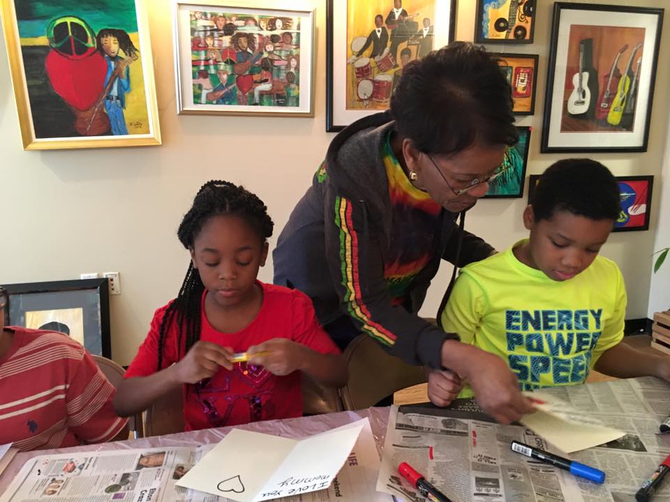 Eunice LaFate leading an art class for kids at her Lafate Gallery.