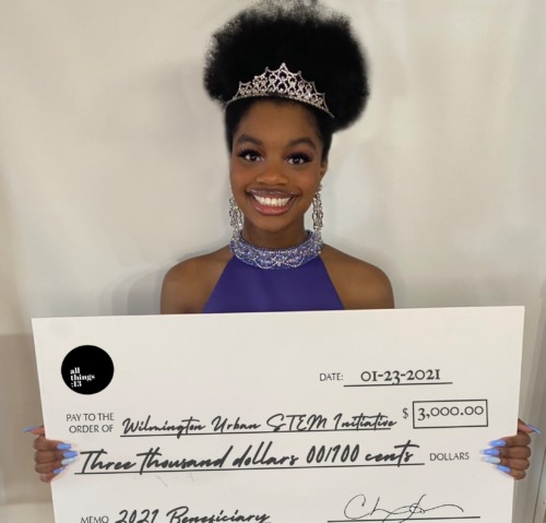 Jacqueline Means with large check