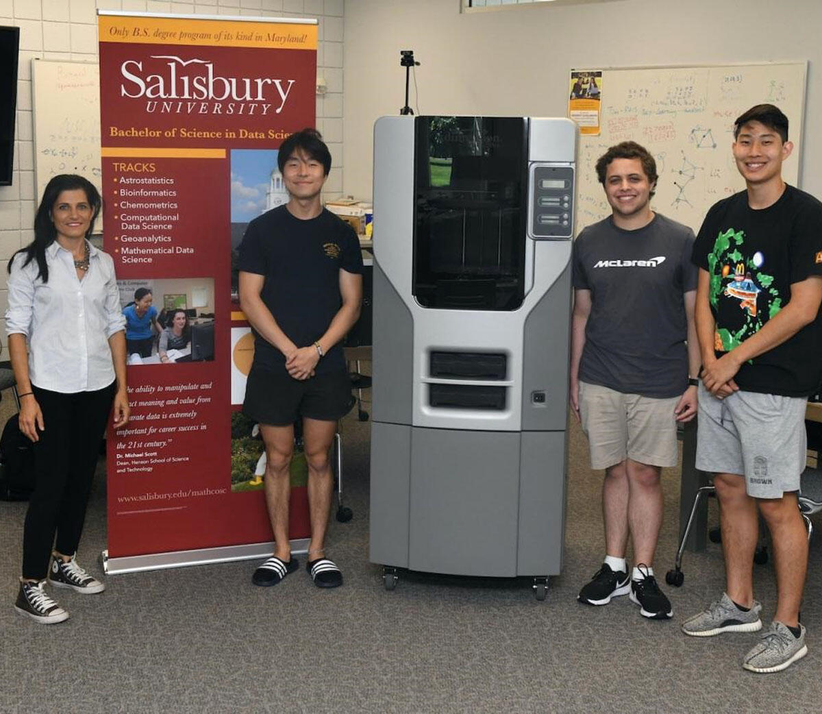 Salisbury U students show off their new 3D printer.