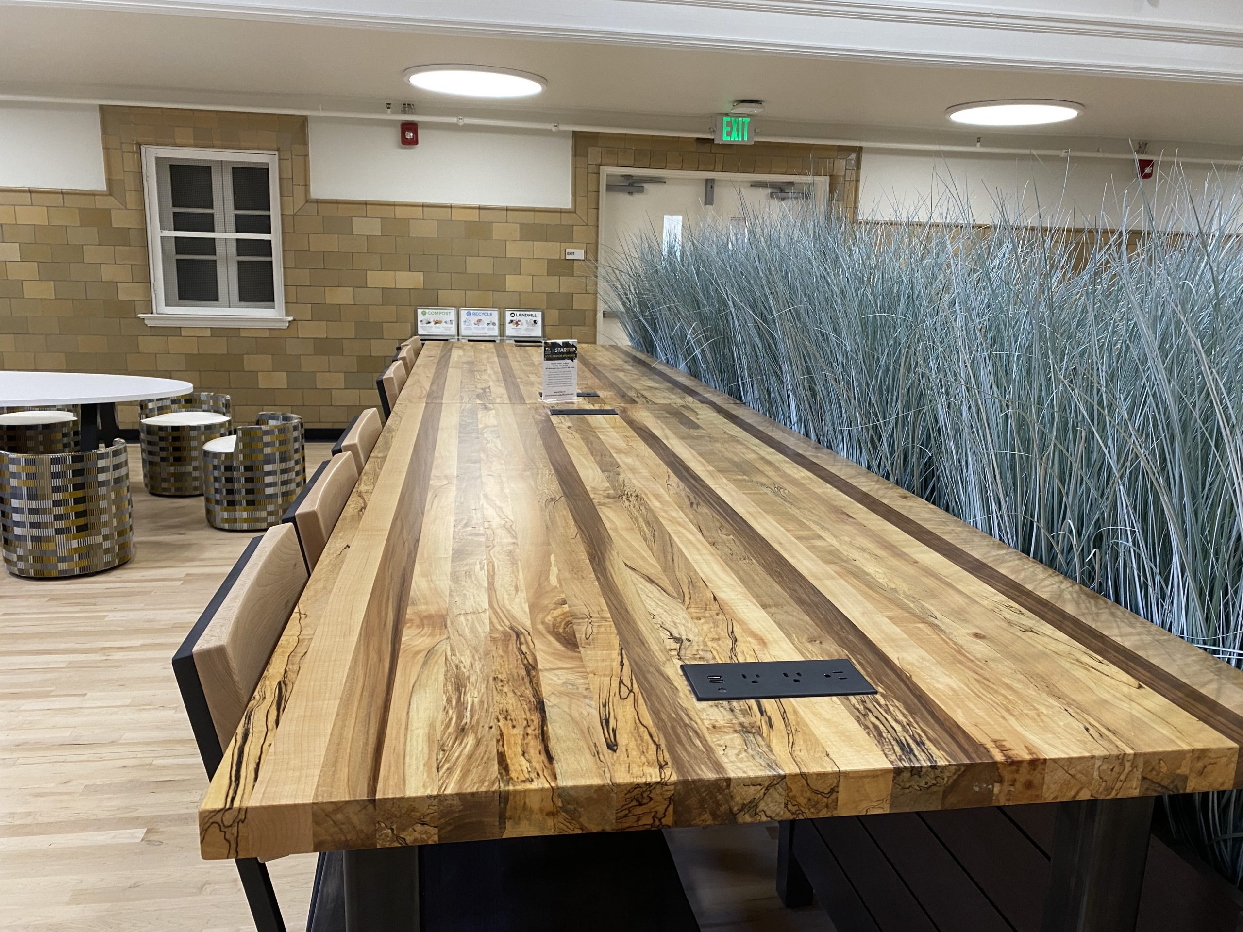 Tables made from locally sourced wood at StarTUp at the Armory.