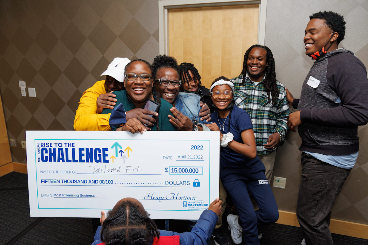 Clarrissa Cozart celebrates her win at the 10th annual Rise to the Challenge business pitch competition, which took place at the University of Baltimore’s Wright Theater.