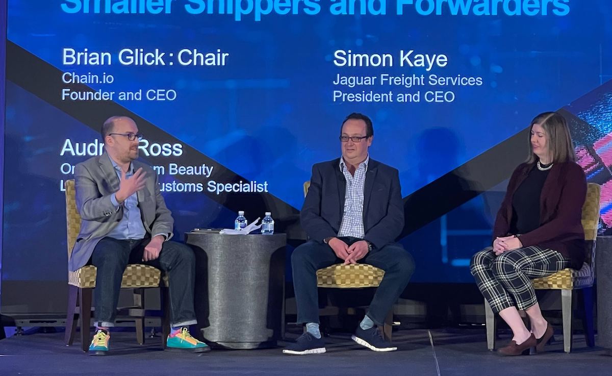 Chain.io founder Brian Glick (left) speaking at the Transpacific Maritime Tech show in February 2022.