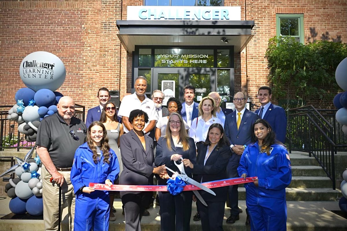 MCCC and Challenger Center officials cutting a ribbon.