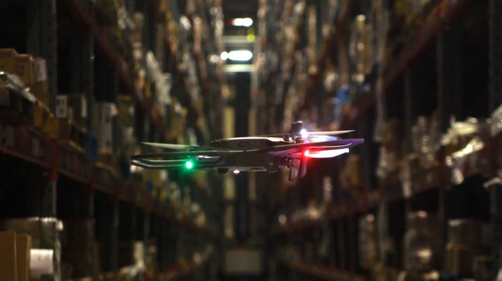 Gather AI’s autonomous inventory drone flying in a warehouse.