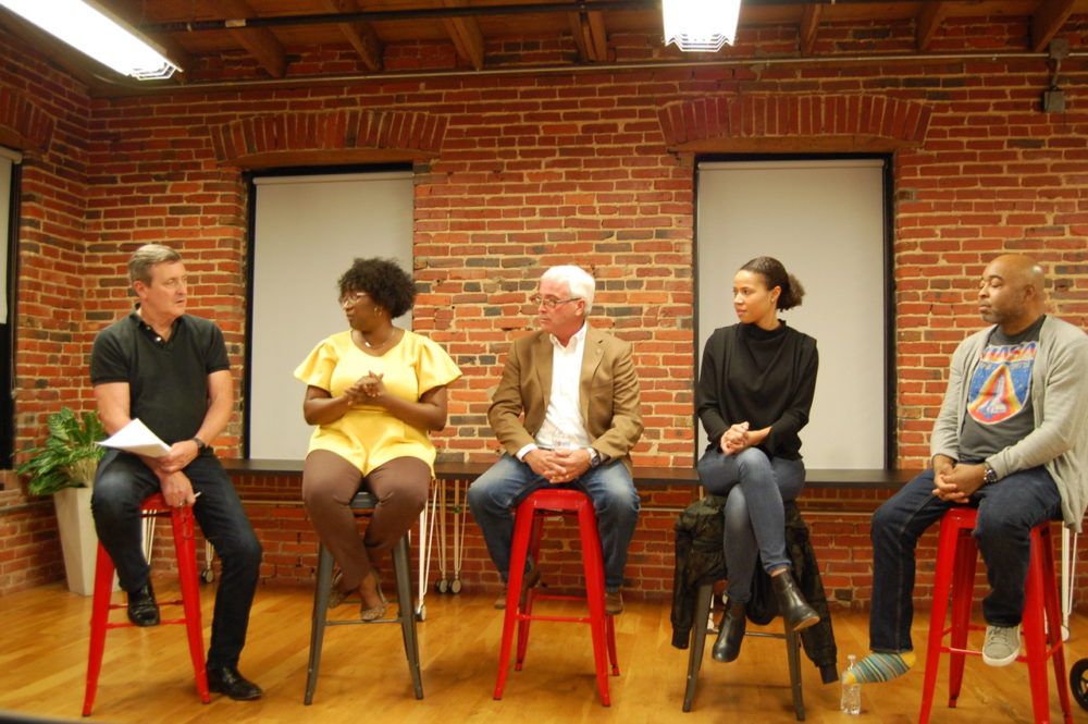 Brendan McAdams (left) moderates a panel of local digital equity and tech leaders. 