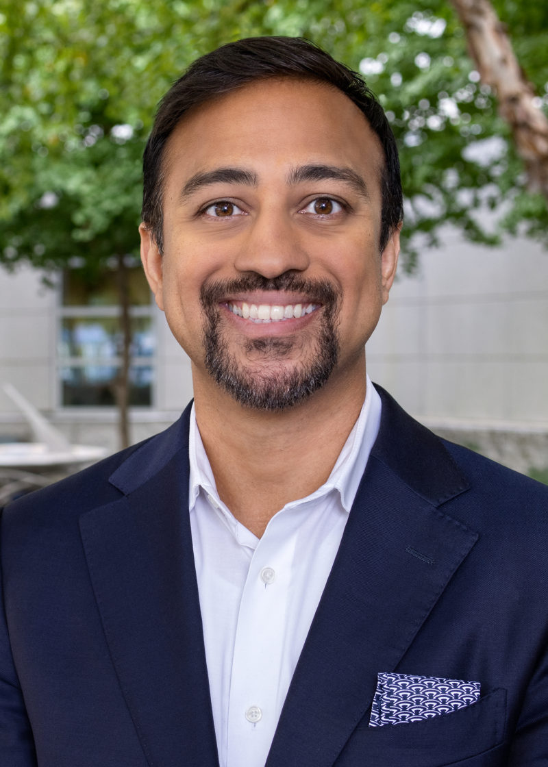 Pothik Chatterjee in front of a tree.