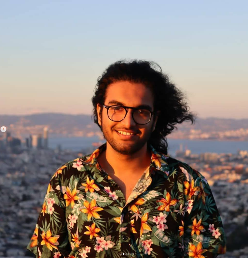 Ansh Chandnani in front of a city background.