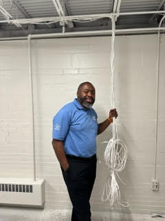 Wayne Nembhard standing with wires.