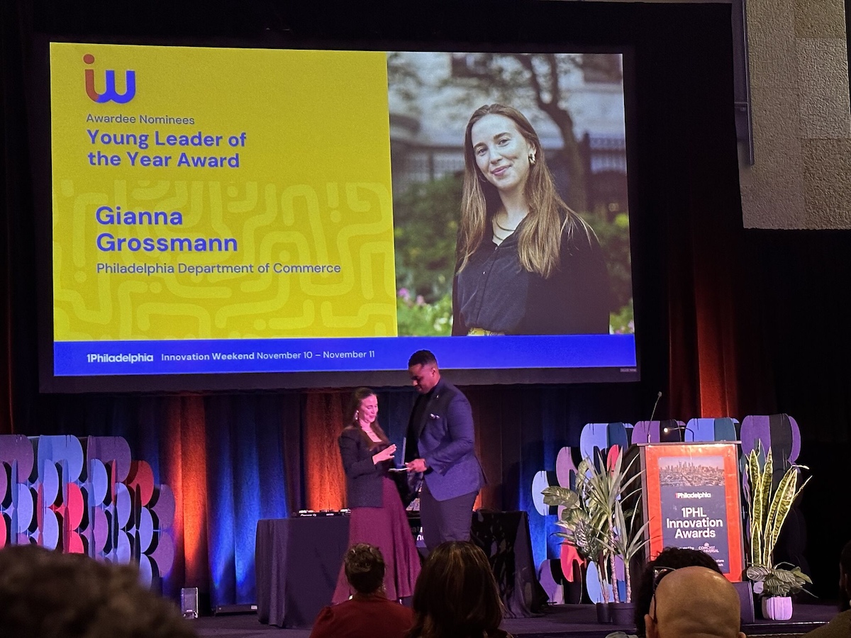 A woman accepts an award onstage.