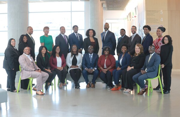 A group of business people posing for a photo.