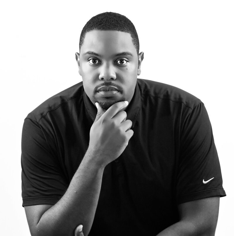 Black-and-white photo of Tremain Davis in black t-shirt with white Nike logo.