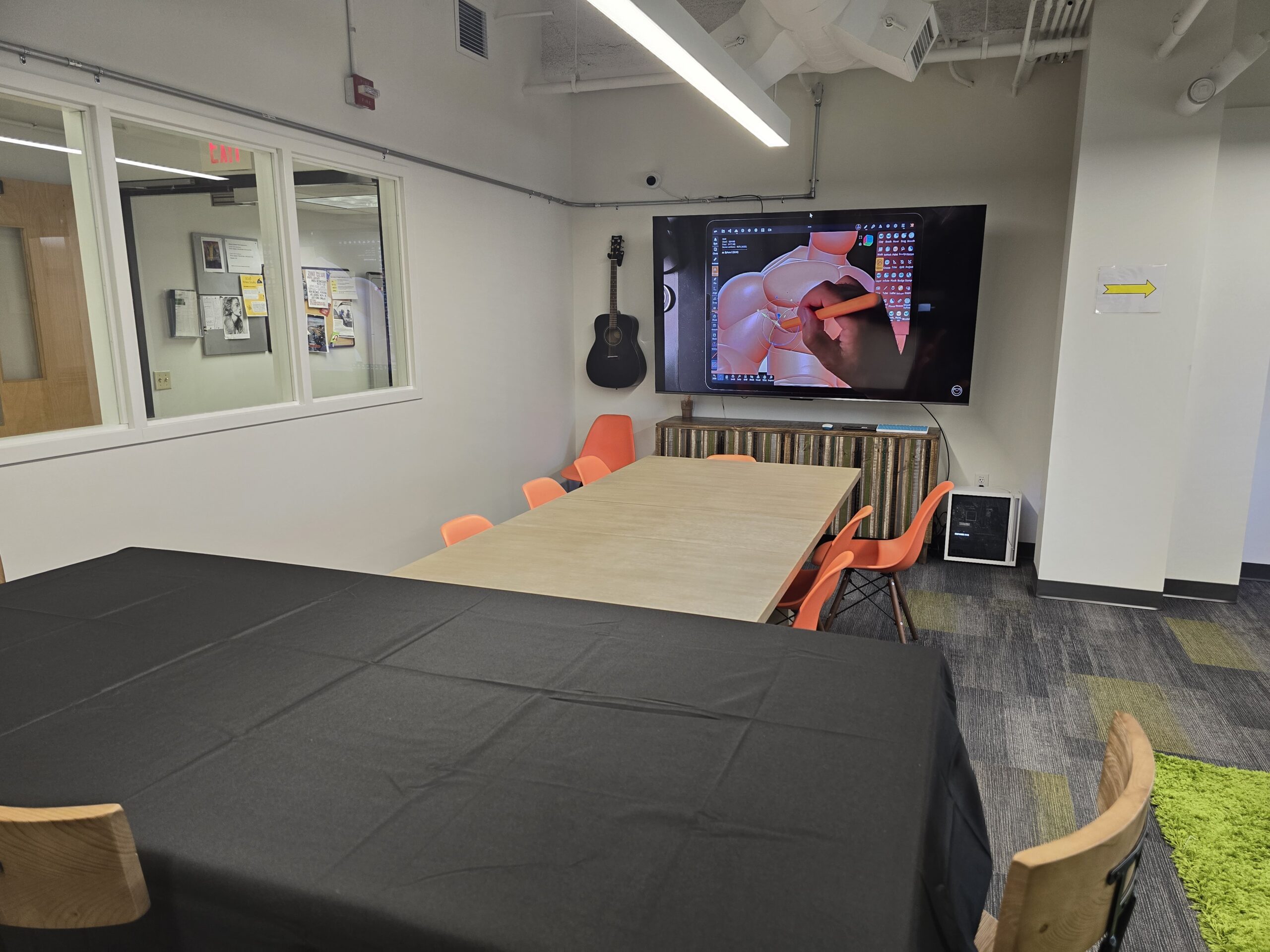 A room with a table and chairs.