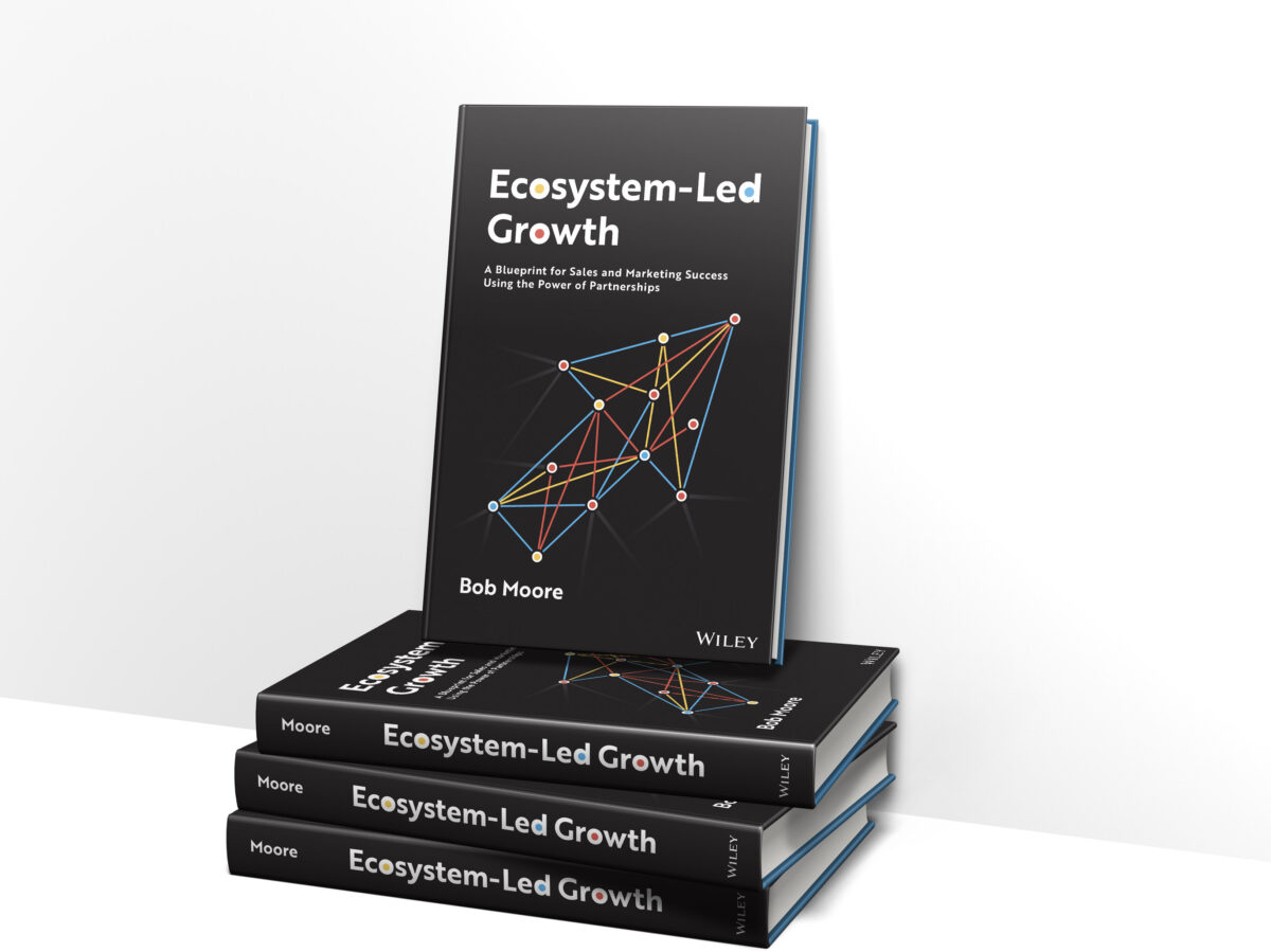 A stack of books with the title "Ecosystem-Led Growth."