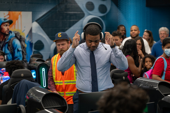 Councilman James Torrence in white and black headphones at the E-Sports Lab.
